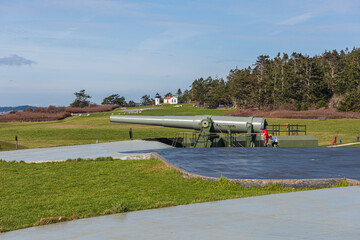 Young Boys Wearing COVID-19 Face Masks Playing on a Disappearing Gun at Fort Casey State Park Whidbey Island Washington