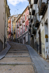 Fototapeta premium road leading up into the old city center of Cuenca along many colorful houses