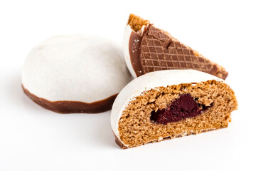 Gingerbread in cut with a berry jam on a white background. Sweet Deassert to tea