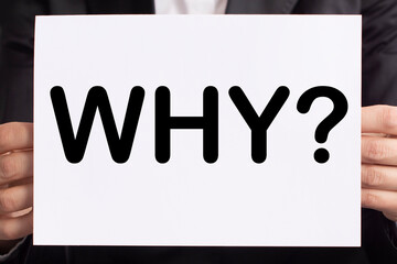 the word why is it written on white paper. Motivation, inspiration concept