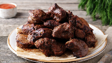 Veal shish kebab on a plate. Closeup