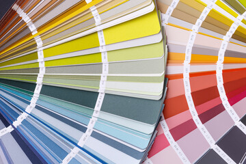 Close-up on color palette guide for printing and painting. Concept - choice of colors for design.