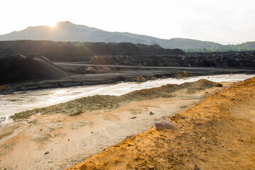 Dirty soil and polluted water on vast territory with bad environmental situation representing ecological catastrophe and desolation
