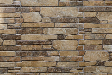 Pattern of stone wall surface. Texture of a stone wall.  Stone wall as a background or texture. Part of a stone wall, for background or texture