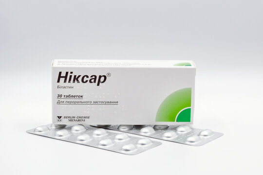 Nixar bilastin tablets by Berlin Chemie Menarini closeup against white.