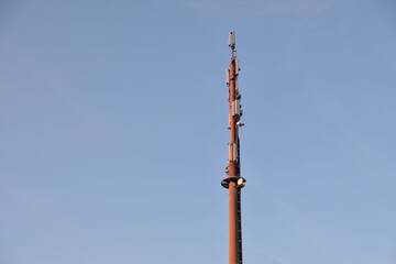 5G Telecommunication tower antenna  on evening sky background. Internet tower. Telecommunication...