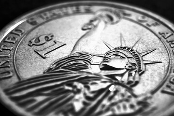 US one dollar coin close-up. Dark dramatic black and white illustration about American money, economy, finance and debt market. State benefits and government assistance. Helicopter money. Macro