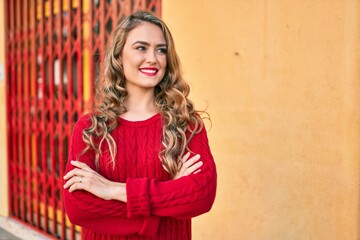Fototapeta premium Young blonde girl smiling happy walking at the city.