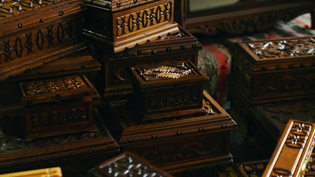 Different size wooden carved chests in gift shop.4K.2.