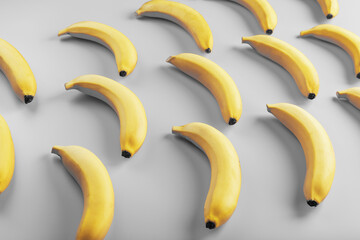 Geometrisches Muster aus gelben Bananen auf grauem Hintergrund in den modischen Farben von 2021.