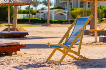 lonely empty sun lounger on the Red Sea beach, evening, winter Sharm El Sheikh, Egypt