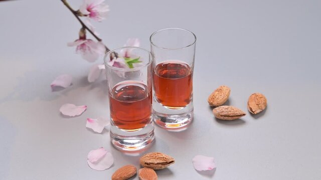 almond liquor. The traditional strong drink in italy to complete the dinner is a liqueur made from nuts and berries. Ratafia, alcohol in shot.