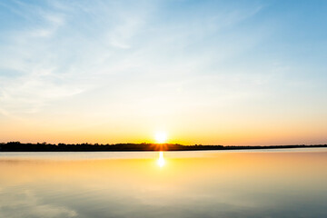 Sunset in the lake, beautiful sunset above the sea landscape background