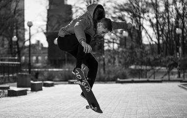 guy is racing on a skateboard down the street