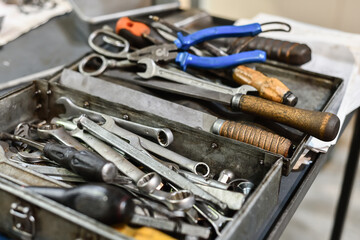 Locksmith's box with keys and tools for repairing mechanical equipment.