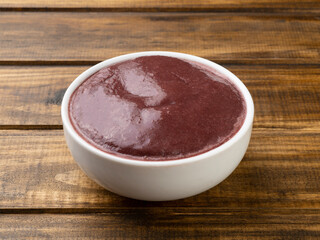 Brazilian typical acai bowl over wooden table