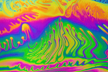 Fototapeta na wymiar Psychedelic multicolor patterns background. Photo macro shot of soap bubbles