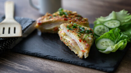 French toast omelette sandwich simple and easy breakfast dish . Indian bread omelette egg and cheese