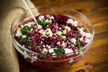 dietary salad of boiled beets with walnuts and cottage cheese
