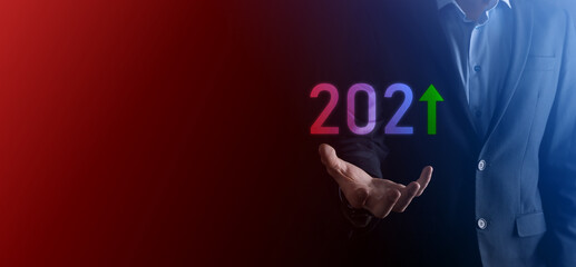 Business development to success and growing growth year 2021 concept.Plan business growth graph in year 2021 concept.Businessman plan and increase of positive indicators in his business.