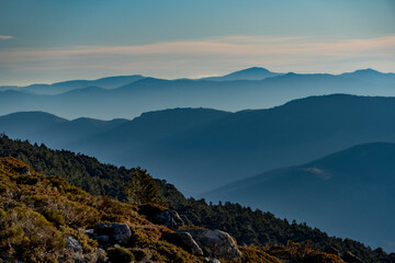 mountains in the morning with fog and blue sky without the sun in the golden hour