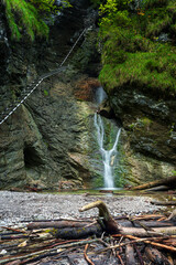 Difficul trail with ladder near the waterfall in canyon of National park Slovak paradise, Slovakia.