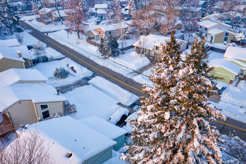 winter sunrise over a residential street in Fort Collins, northern Colorado, after heavy snowstorm -  aerial view