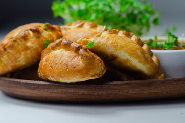 Mini pasties with tomato sauce, succulent pork, turkey, bacon and cranberry all wrapped in shortcrust pastry