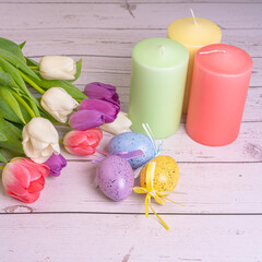Bouquet of flowers. Tulips close-up. Various colors. Easter eggs, candles. Postcard, Spring and Happy Easter