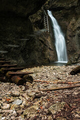 Difficul trail with ladder near the waterfall in canyon of National park Slovak paradise, Slovakia.
