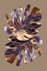 Monstera leaves painted in silver with gold flares. Minimalist luxury concept. Good for interior...