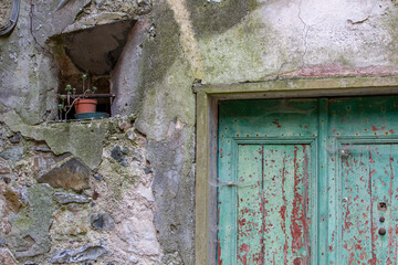 Old Italian street decor. Old green door.
