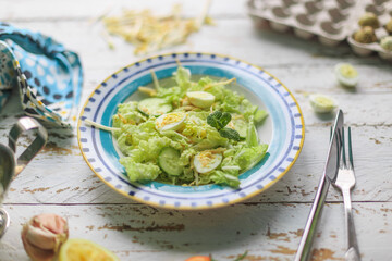 Healthy salad with quail eggs and cucumbers