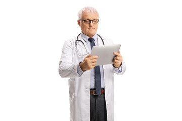 Mature doctor holding a digital tablet