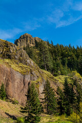 Rocky Outcrop and Mountain Scene Along The Columbia River Gorge