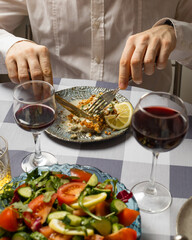 Cutlery in hand at a meal
