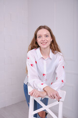 Young beautiful girl show clothes for an online store.  Bright clothes.
