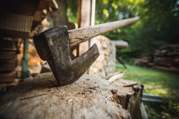 Axe in the stump ready for choping woods