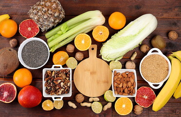 Healthy bright fruits, vegetables, seeds for weight loss, detox diet and healthy lifestyle concept,...