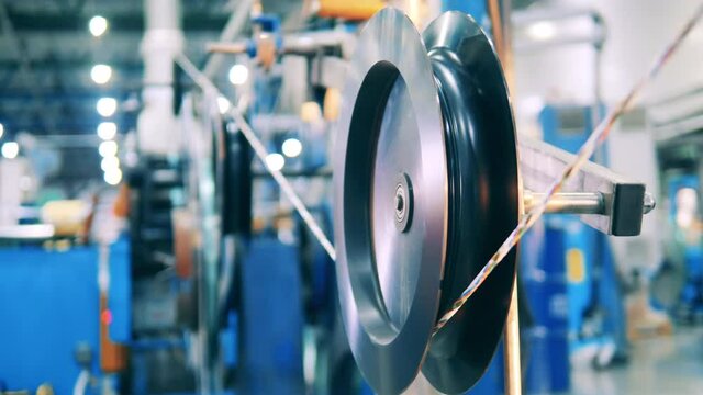 Large shaft with thick power cable at a cable making facility