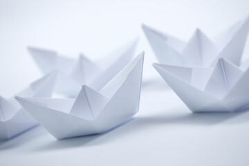 paper boats on the white