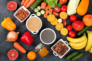 Healthy natural food with diet ingredients, vegetables, fruits, nuts, seeds for weight loss, detox diet and healthy lifestyle concept, place for text, selective focus