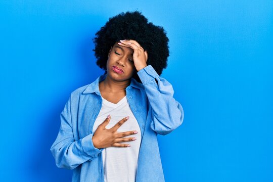 Young african american woman wearing casual clothes touching forehead for illness and fever, flu and cold, virus sick