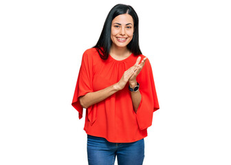 Beautiful young woman wearing casual clothes clapping and applauding happy and joyful, smiling proud hands together