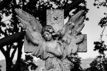 Angel on a cross black and white