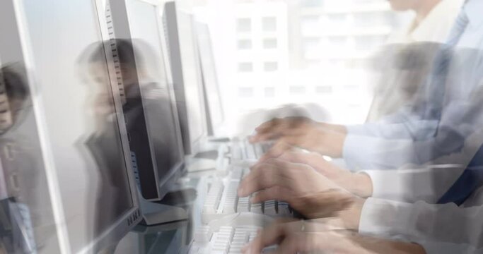 Animation of team of colleagues typing on computer keyboards with people walking in fast pace