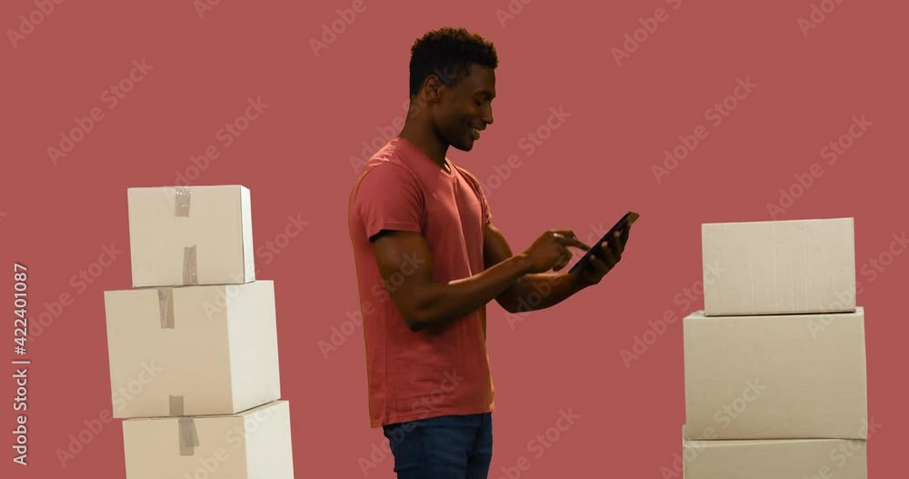 Poster animation of man using tablet with stacks of boxes on red background
