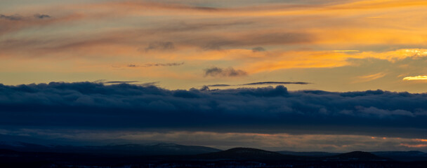 Orange glowing clouds at sunset. Shot in Sweden, Scandinavia