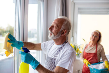 Senior couple doing chores