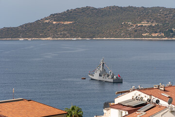 Turkish naval forces military ship in mediterranean sea in bay. Warship patrol protection of border.